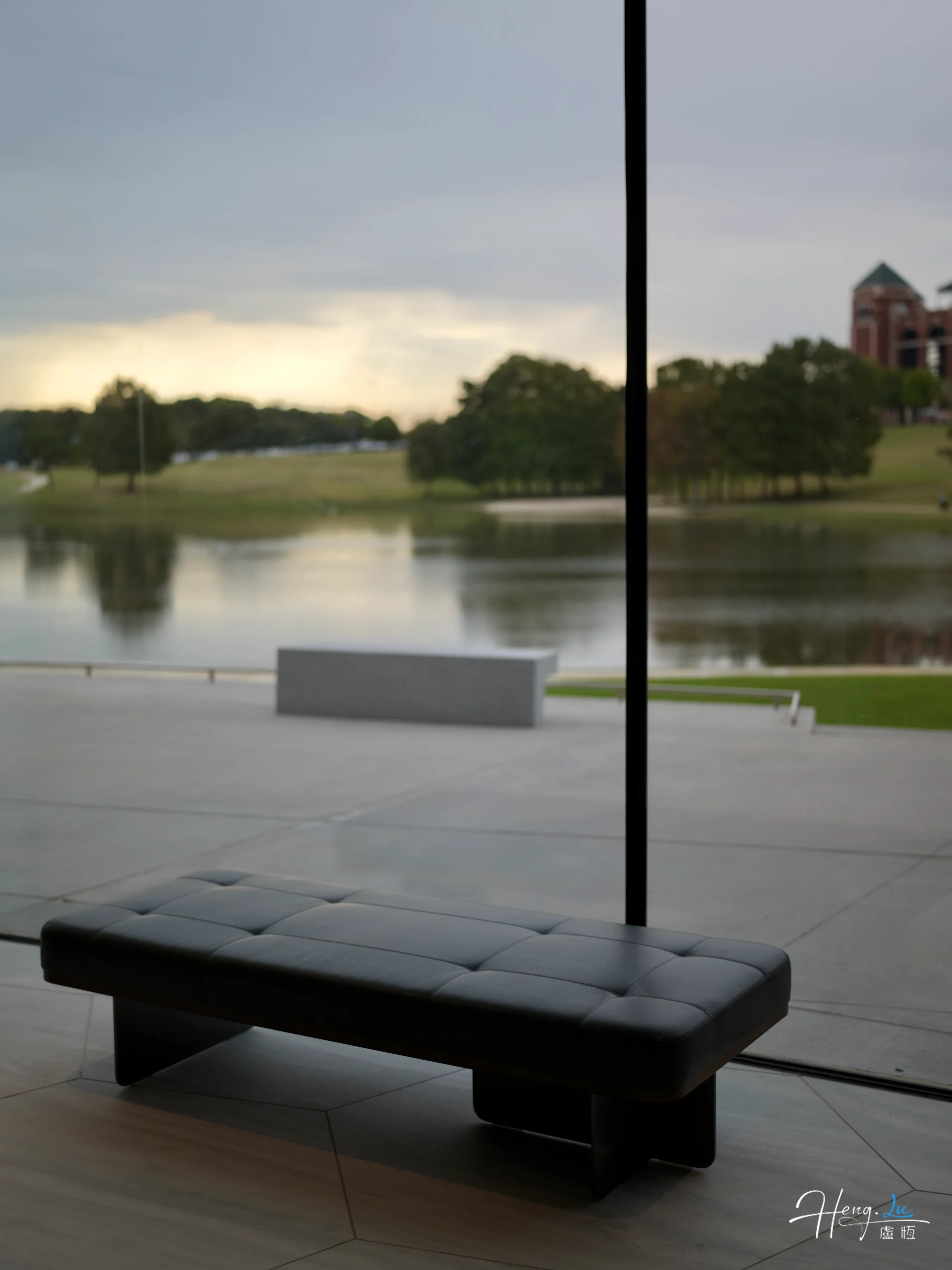 Modern bench by window photographed by Heng Lu